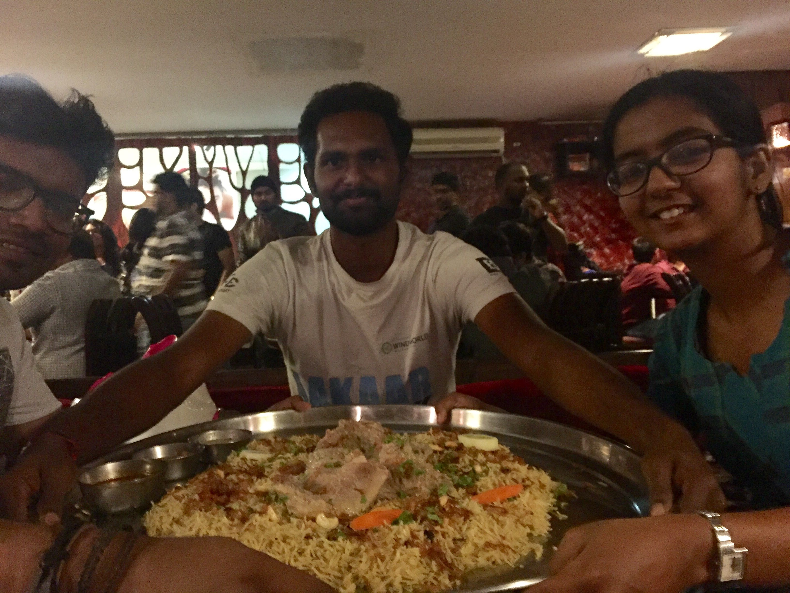 Myself in the center holding both hands in the mandi plate with my friends