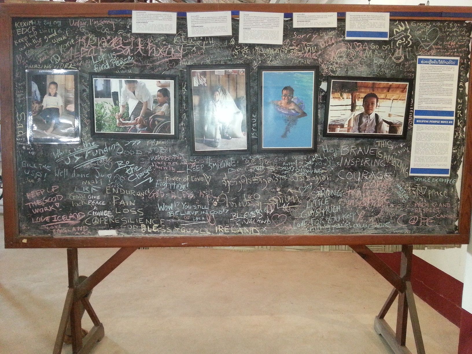 A board displaying children's who victims from UXO and visitors can write their message to them