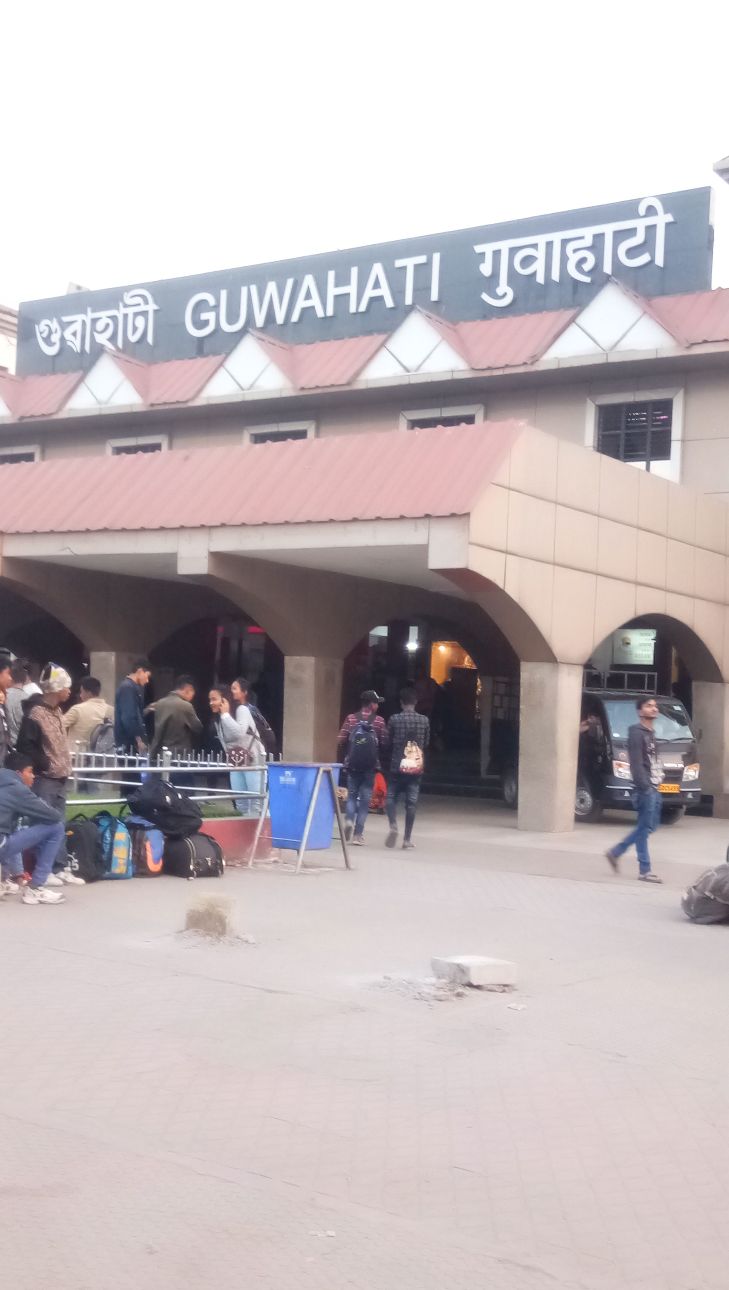 Caption Photo-Guwahati Railway Sation,Busy and fast Station in North-East,Here have to see many busy peoples,Front side can book your online Car and next you go Hotel,Next day Attraction places ,Really good enviroment sarounding places Most Views is National parks,International Airport and more Foods of Indian  .Location of Photo-Guwahati Railway Station,Assam in India,
