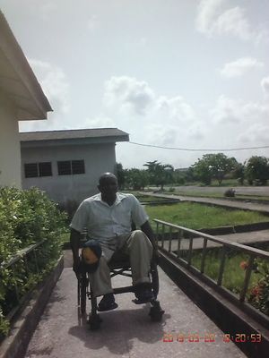 Caption: Photo of a man on wheelchair trying to wheel up the wheelchair ramp. The wheelchair ramp is very important for wheelchair accessibility. The wheelchair ramp must be of standard specification to help  them climb the ramp without any difficulty. Local Guides must put the physically challenged persons into consideration in their activities on Google maps.