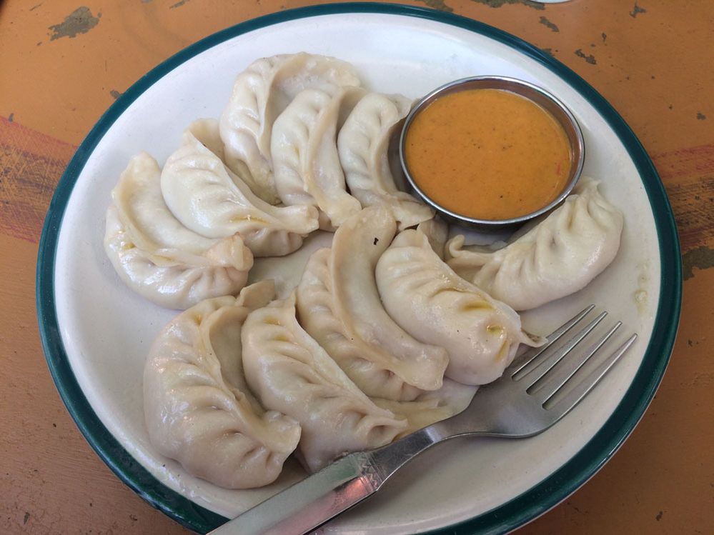 Nepali chicken dumplings (momo) Momo (dumplings) is one of Nepal's most popular dishes which can be eaten as an entree or as mains. It's a dumpling filled with meat or vegetables as well. It is eaten with tomato pickle (golbheda ko achar)